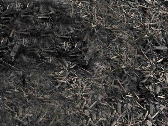 Bark mulch ground cover used in a planting bed