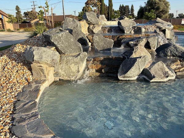 Backyard boulder waterfall landscape project