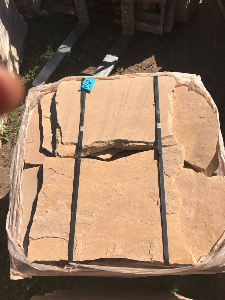 Arizona Buckskin Stripe & Swirl Flagstone Standup 2" grade, large select flagstone slabs stood on edge and strapped for delivery