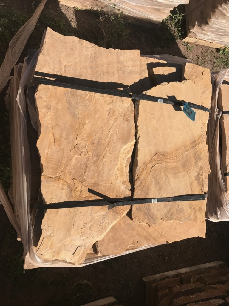 Arizona Buckskin Stripe & Swirl Flagstone Standup 2" grade, large select flagstone slabs stood on edge and strapped for delivery