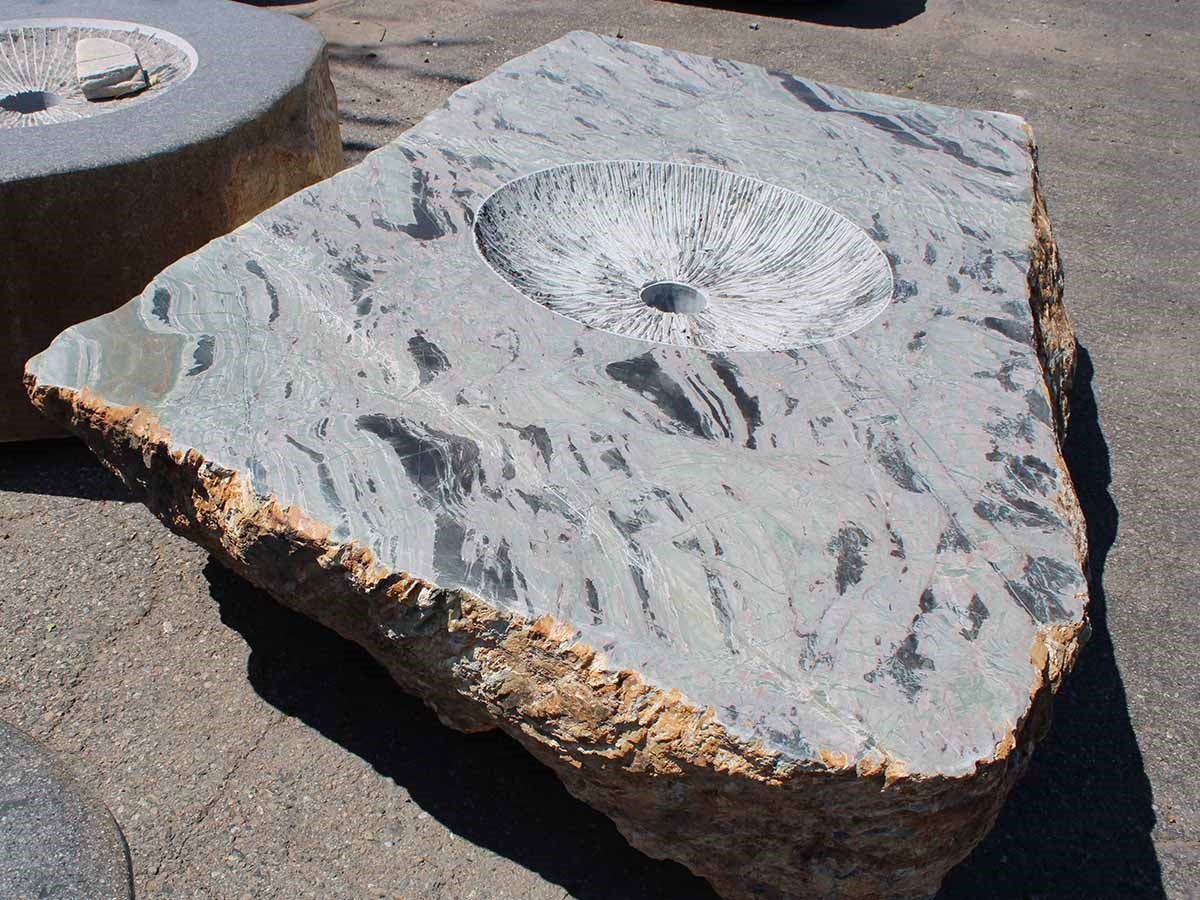 Grey marble boulder fire pit