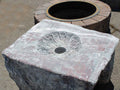 Rose grey marble boulder fire pit