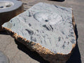 Grey marble boulder fire pit