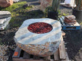 White marble boulder fire pit with fire glass