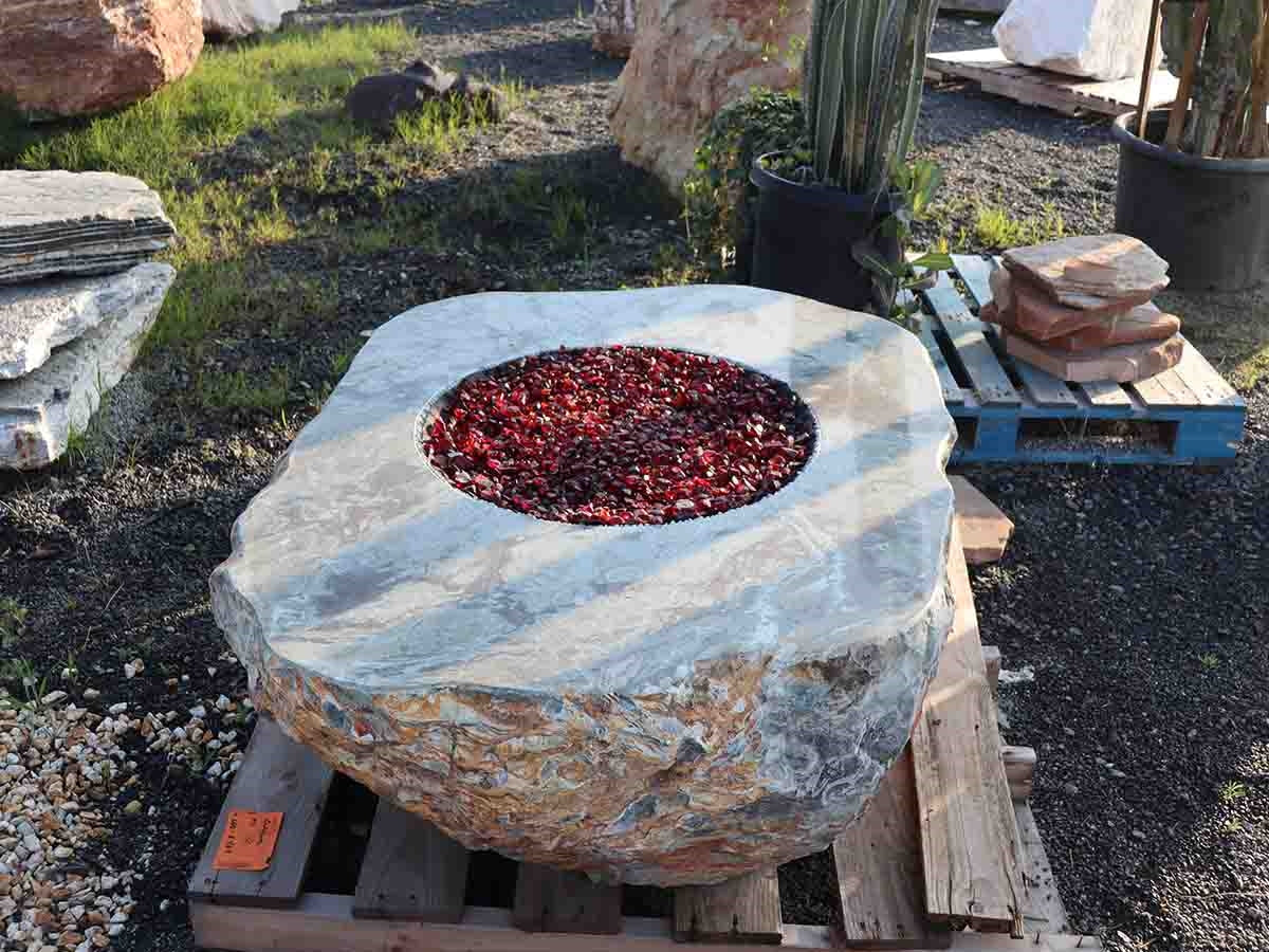 White marble boulder fire pit with fire glass