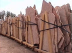 Arizona Rosa Flagstone Standup 1-3/4" grade, large select flagstone slabs stood on edge and strapped for delivery