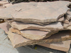 Arizona Rosa Flagstone Standup 1-3/4" grade, large select flagstone slabs stood on edge and strapped for delivery