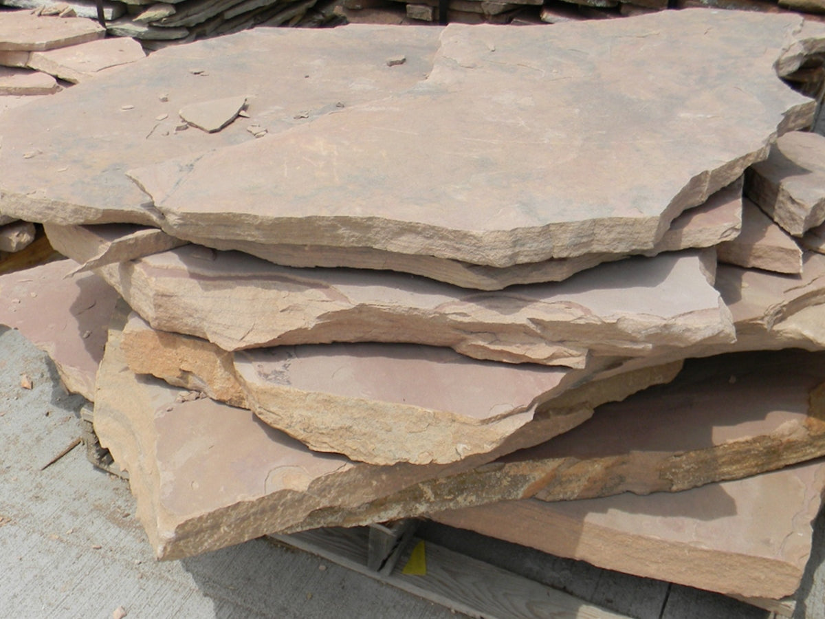 Arizona Rosa Flagstone Standup 1-3/4" grade, large select flagstone slabs stood on edge and strapped for delivery