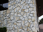 Lompoc Oatmeal stone wall veneer showing the cream and gold color