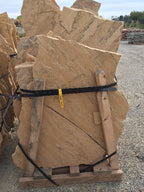 Arizona Buckskin Swirl Flagstone Standup 1-1/4" grade, large select flagstone slabs stood on edge and strapped for delivery