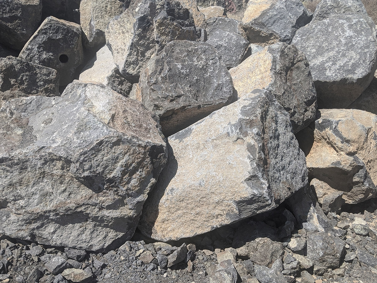 Black basalt boulders in the 2 foot size class for garden accents and borders