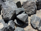 Bulk Black Hawk boulders in stock at an Earth Stone Rock yard in California
