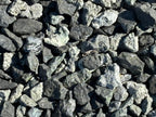 Close up of Black n Silver Rock 1 inch crushed landscape rock showing charcoal black stone flecked with silver gray
