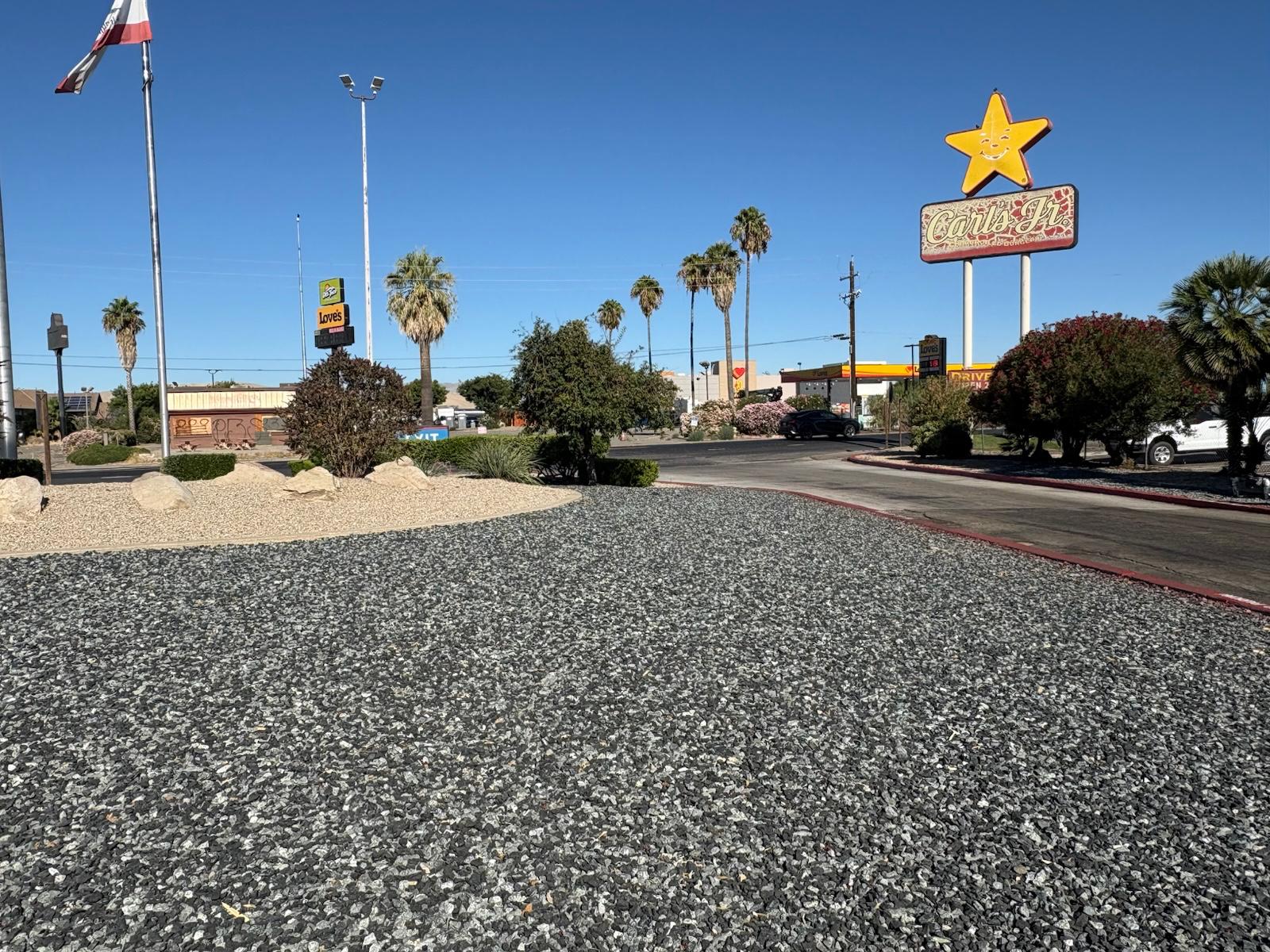 Black n Silver Rock 1 inch ground cover across a commercial street frontage landscape