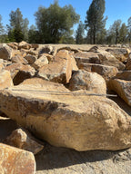 Carmel Gold Granite boulders with a tape measure laid across for scale