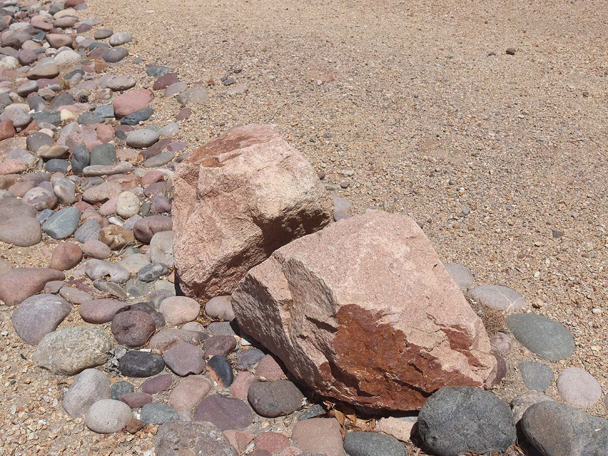 Champagne Granite landscape boulders, 18 to 24 inch size
