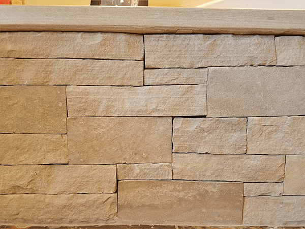 Santa Fe snapped and cleft face Fossil Creek stone veneer wall